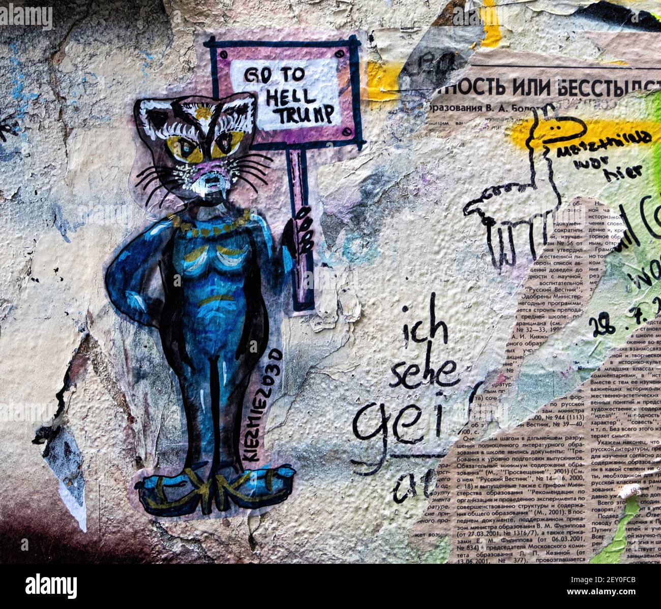 Bright little paste-ups in the inner courtyard at Haus Schwarzenburg that is  deserted during the Covidpandemic, Mitte, Berlin Stock Photo