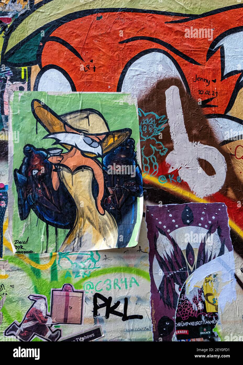Bright little paste-ups in the inner courtyard at Haus Schwarzenburg that is  deserted during the Covidpandemic, Mitte, Berlin Stock Photo