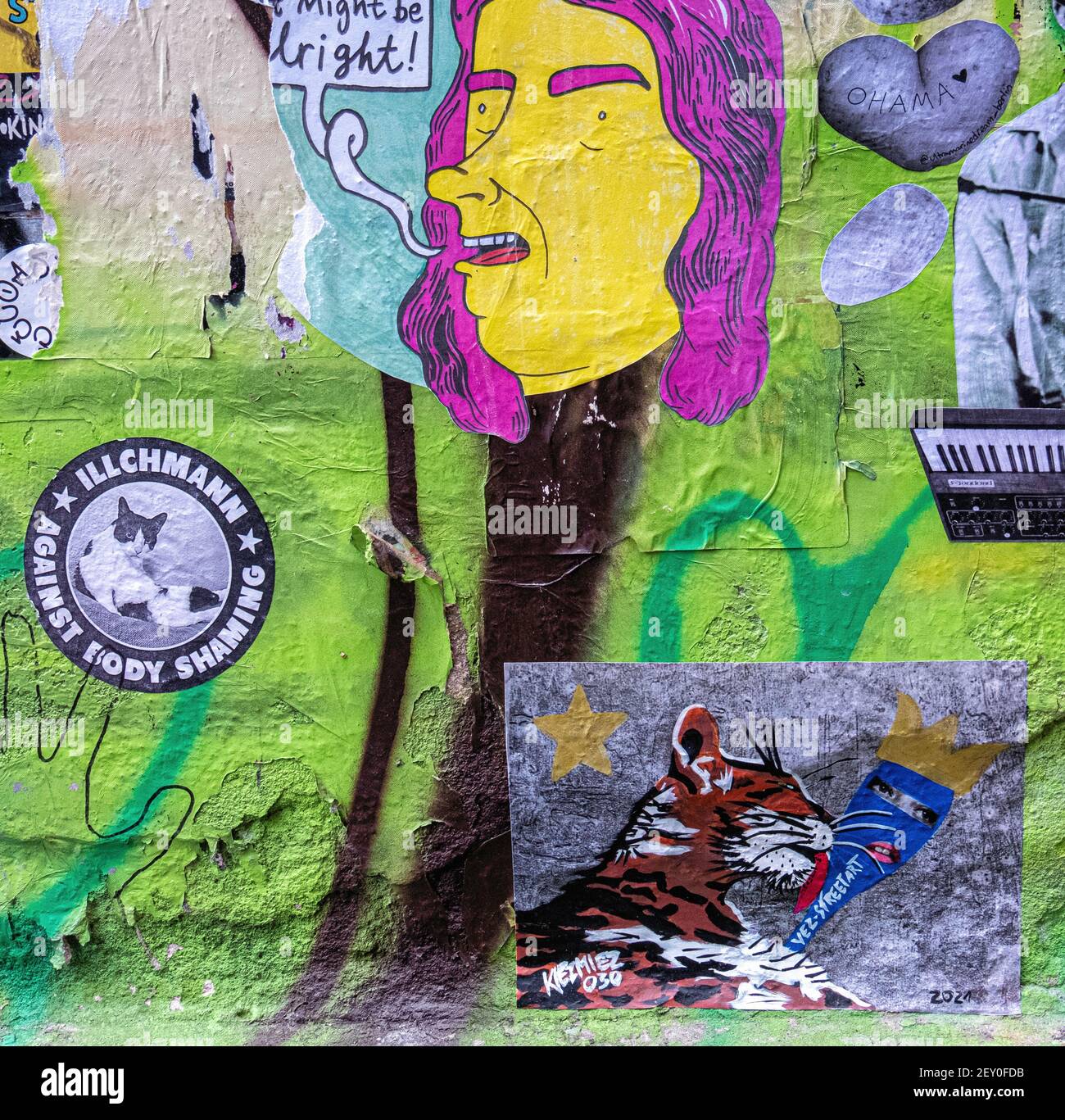 Bright little paste-ups in the inner courtyard at Haus Schwarzenburg that is  deserted during the Covidpandemic, Mitte, Berlin Stock Photo