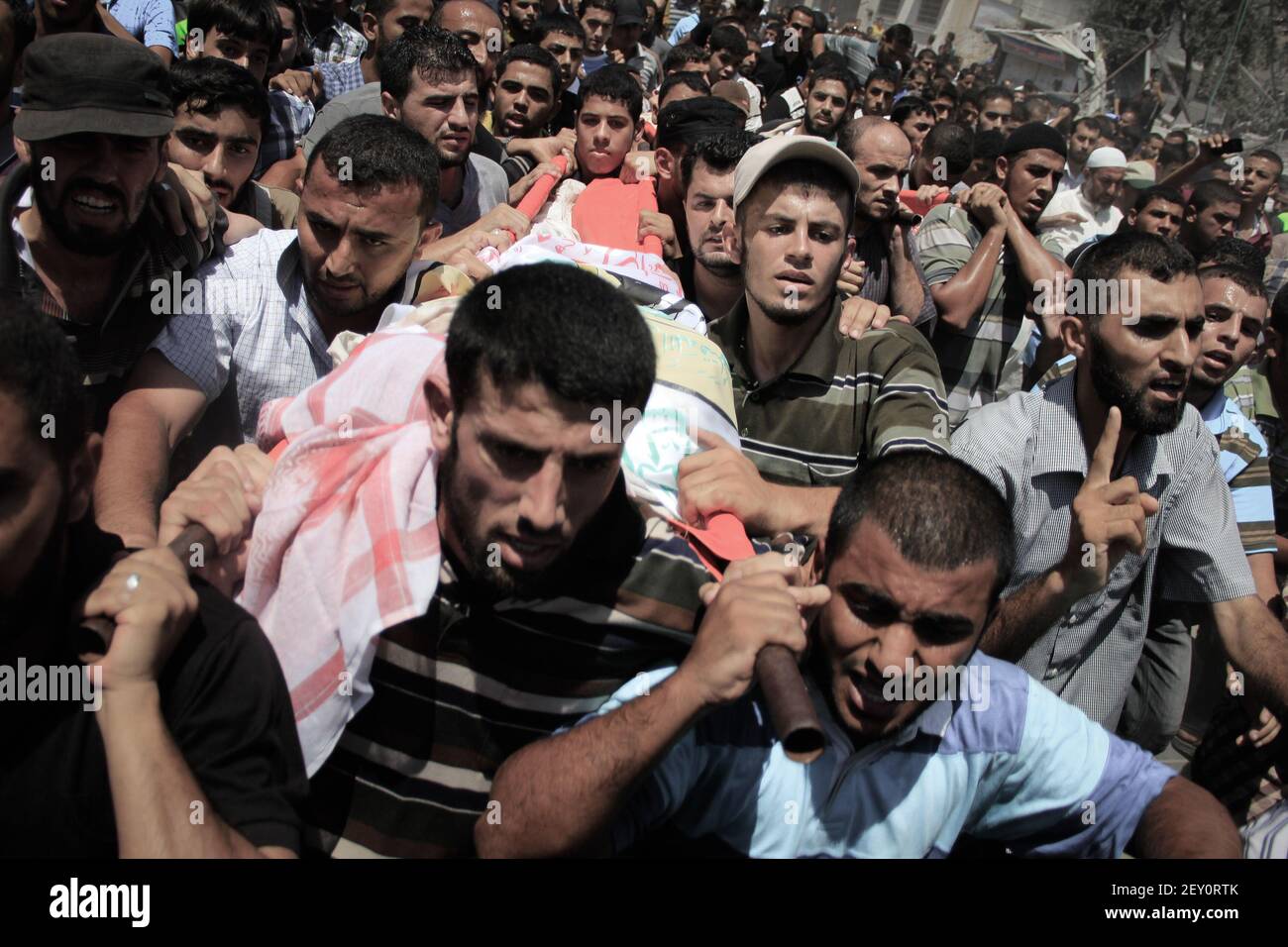 GAZA STRIP - AUGUST 21, 2014 - Palestinians carry the body of Mohammed ...