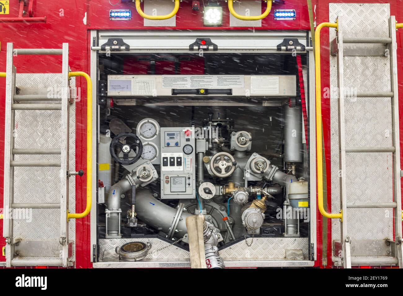 Fire truck equipment inside back vehicle. Open back side of red