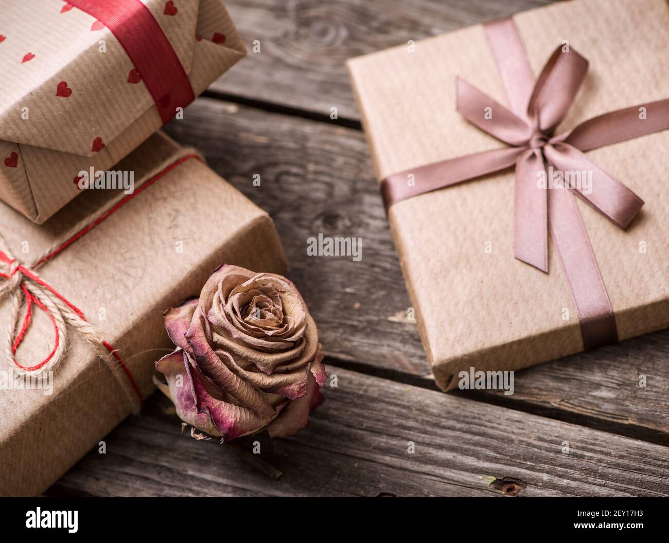 Rose flower among the gift boxes Stock Photo