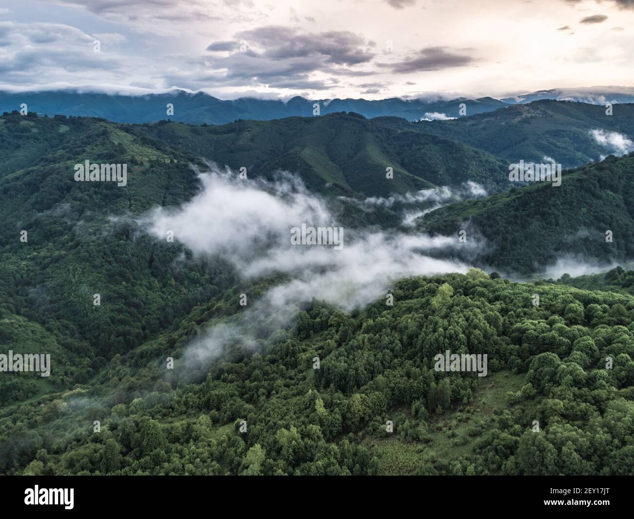 Aerial view of green mountain in cloudy day Stock Photo - Alamy