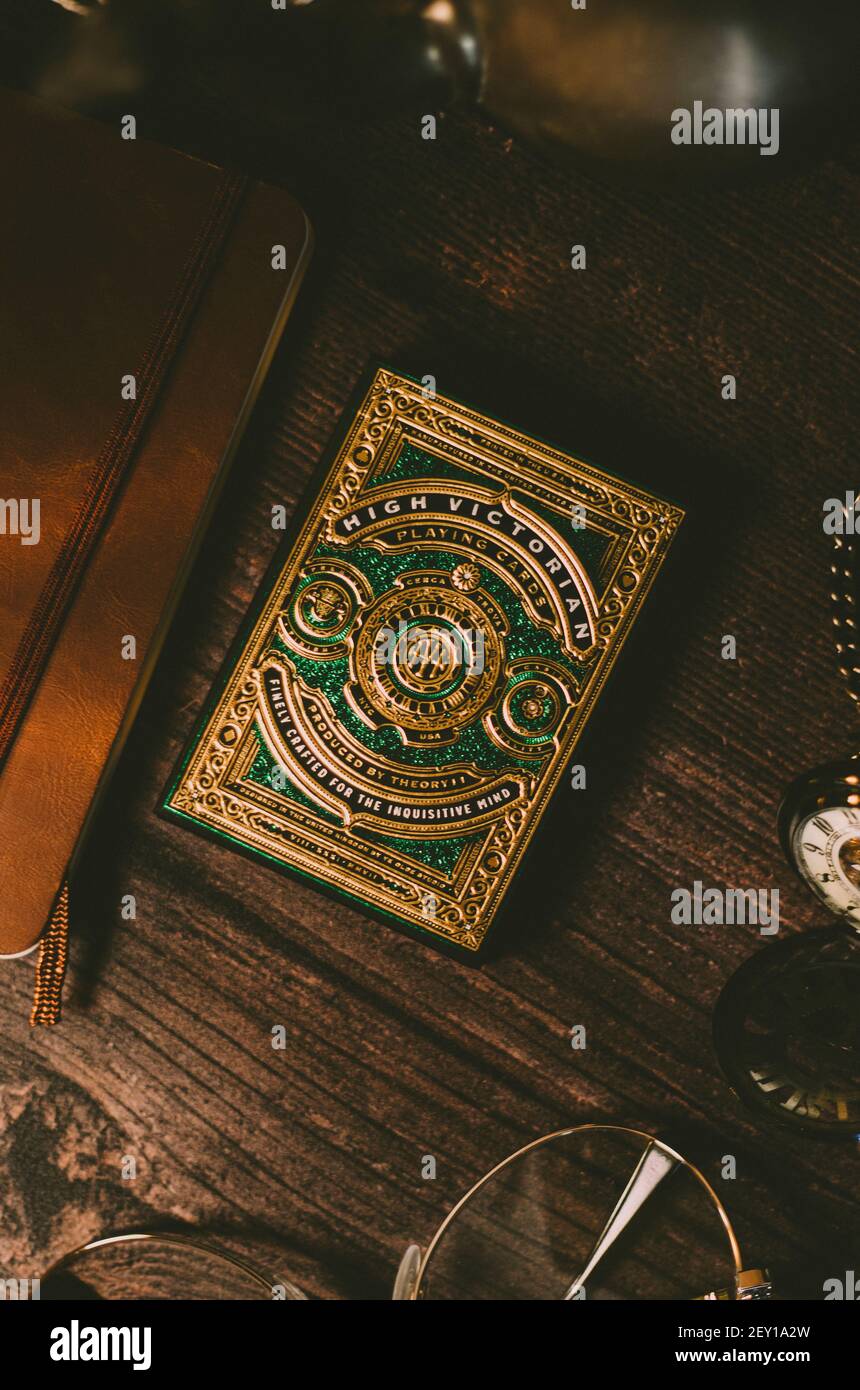 Gold and Green playing cards, In a styled matching background Stock Photo