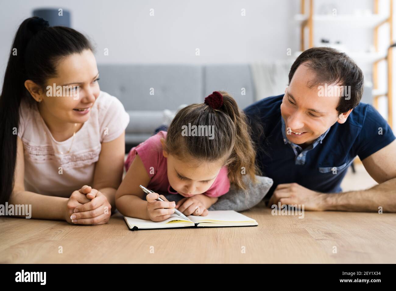 Creative Family Fun Together With Child Drawing Stock Photo