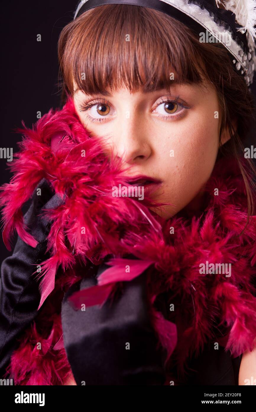 Young woman with feather boa Stock Photo