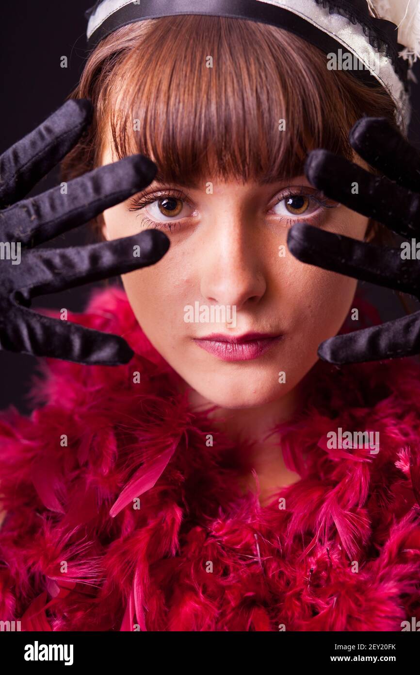 Young woman with feather boa Stock Photo