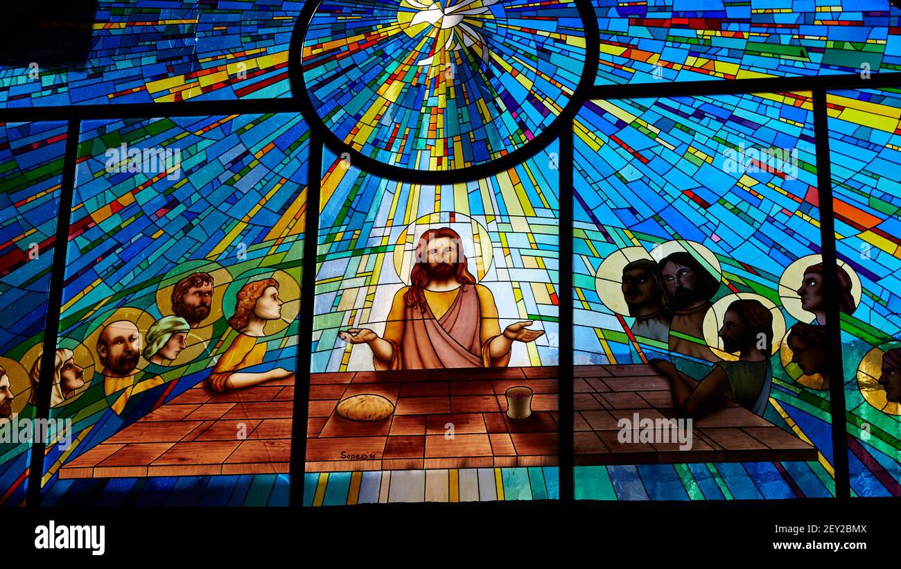 Stained glass window depicting Jesus and the twelve Stock Photo