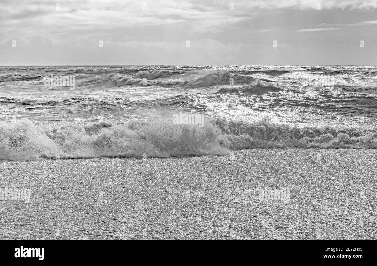 A black and white Fine art high key image-Sand Sea and Sky at Shoreham beach, England Stock Photo
