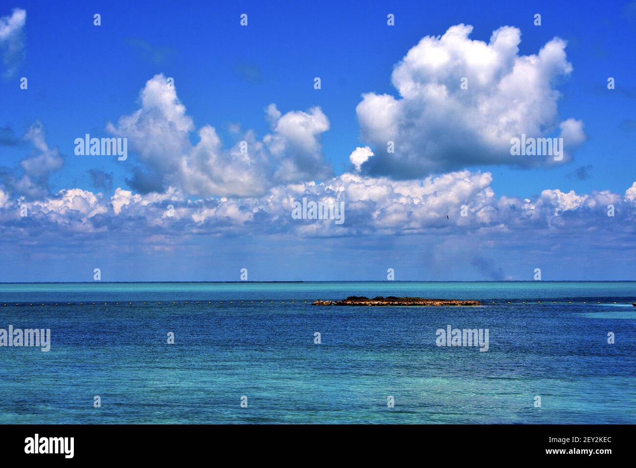 Coastline and rock in the blue lagoon Stock Photo - Alamy