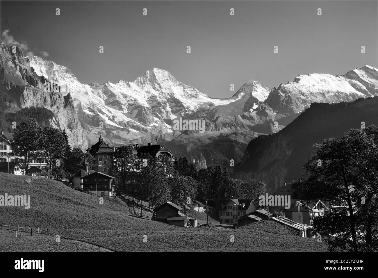 The village of Wengen above the Lauterbrunnental with the Breithorn beyond, blocking the valley: Bernese Oberland, Switzerland.  Black/white version Stock Photo