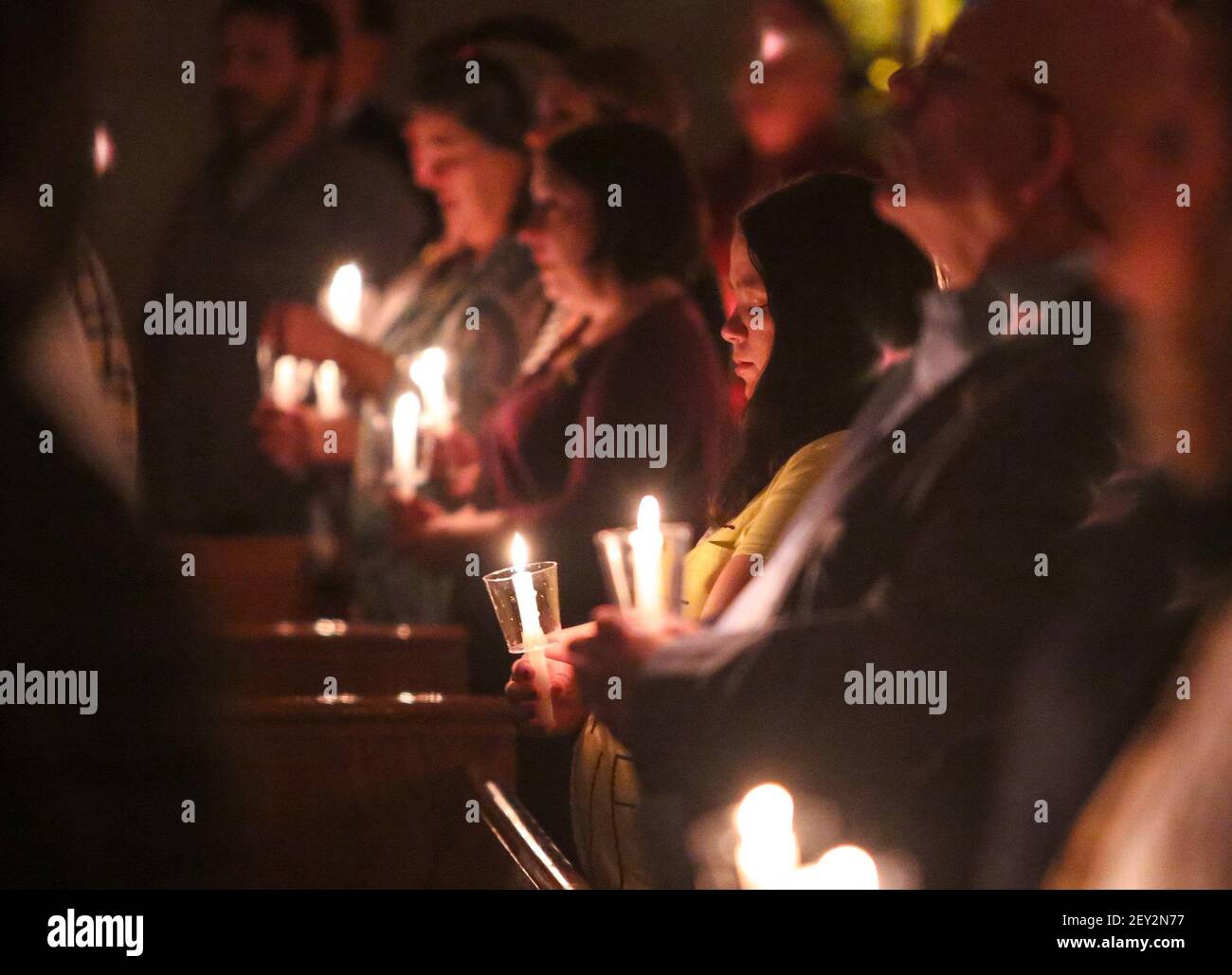 The congregation lit candles as a sign of hope during a prayer vigil