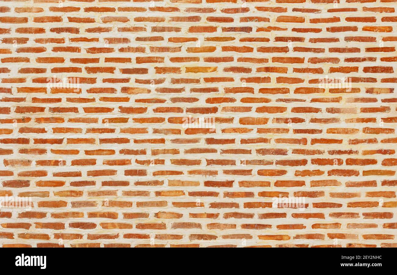 Brick wall background with white joints Stock Photo
