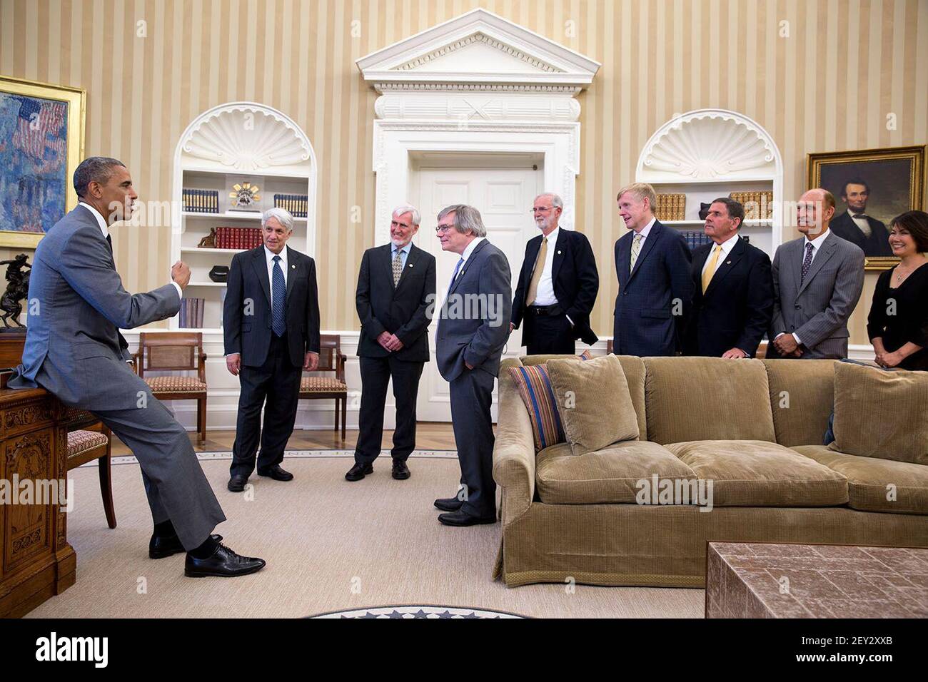President Barack Obama greets four of the nine 2014 Kavli Prize laureates with representatives from the Kavli Foundation and other guests in the Oval Office, July 31, 2014. The 2014 Kavli Prize laureates were selected for making fundamental contributions to the theory of cosmic inflation, to our understanding of the resolution limits of optical microscopy, and for the discovery of specialized brain networks for memory and cognition. (Photo by Pete Souza/White House/Sipa USA) This official White House photograph is being made available only for publication by news organizations and/or for perso Stock Photo