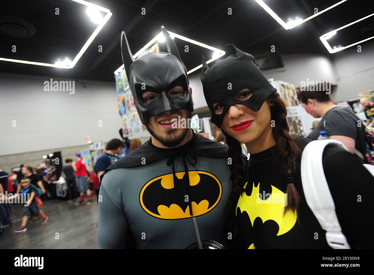 Batman and Batwoman pose for pictures at the Rose City Comic Con in  Portland, Ore., on September 20, 2014. The two day event attracts hundreds  of cosplayers and comic book fanatics from