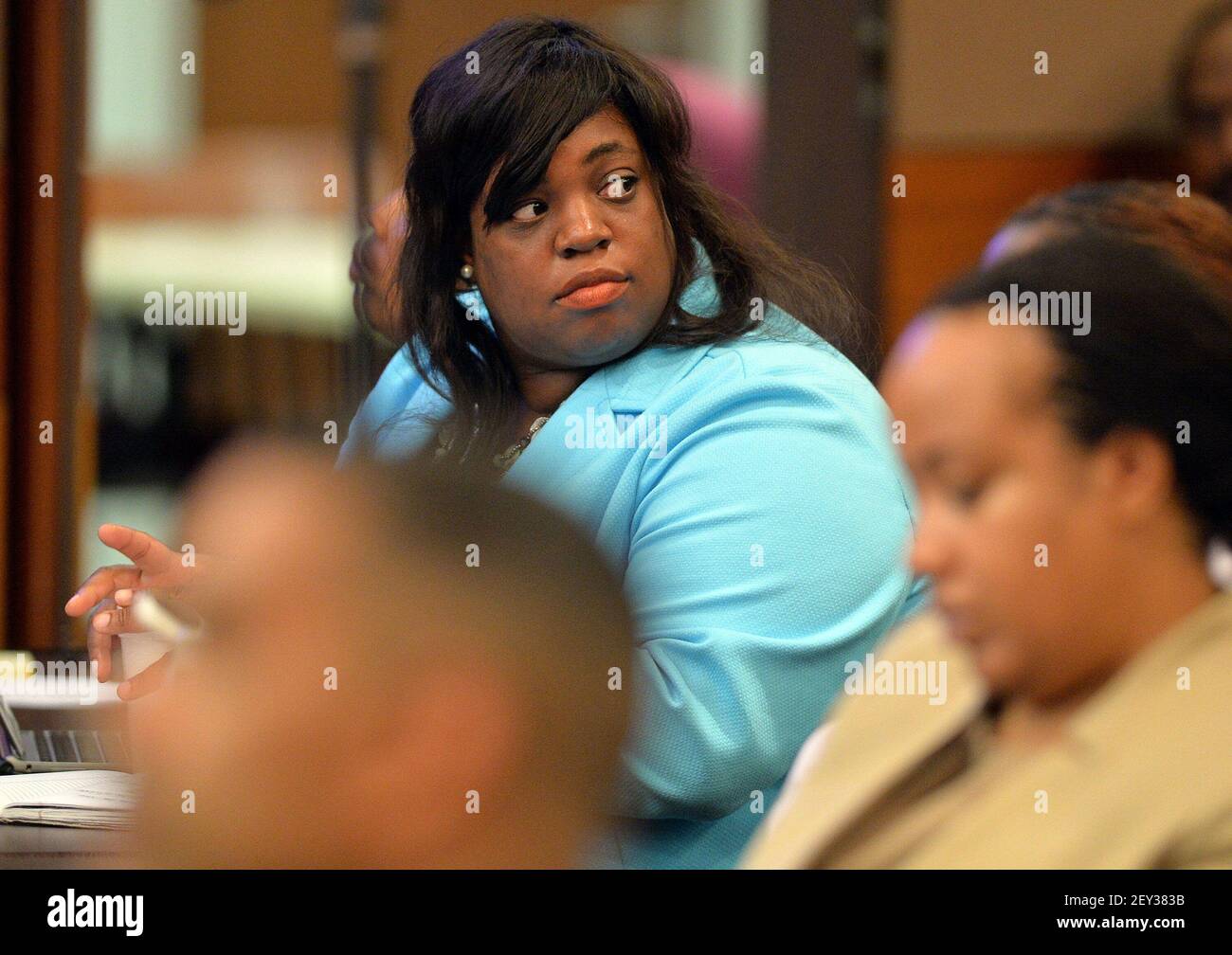 Defense attorney Angela Johnson listens to the state's opening argument.  The prosecution will lay out its case during an expected three-hour-long  opening statement to kick off the Atlanta Public Schools test-cheating trial