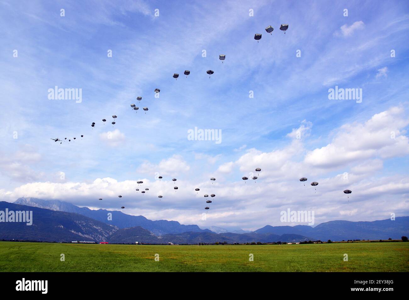 U.S. Army Paratroopers with the 173rd Brigade Support Battalion, 173rd Airborne Brigade Combat Team conduct an airborne operation with T-11 parachutes from a C-130 Hercules aircraft at Juliet Drop Zone in Pordenone, Italy, Sept. 24, 2014. The C-130 Hercules aircraft is assigned to the 86th Airlift Wing, based out of Ramstein Air Base, Germany. (Photo by Paolo Bovo, U.S. Army/DoD/Sipa USA) Stock Photo