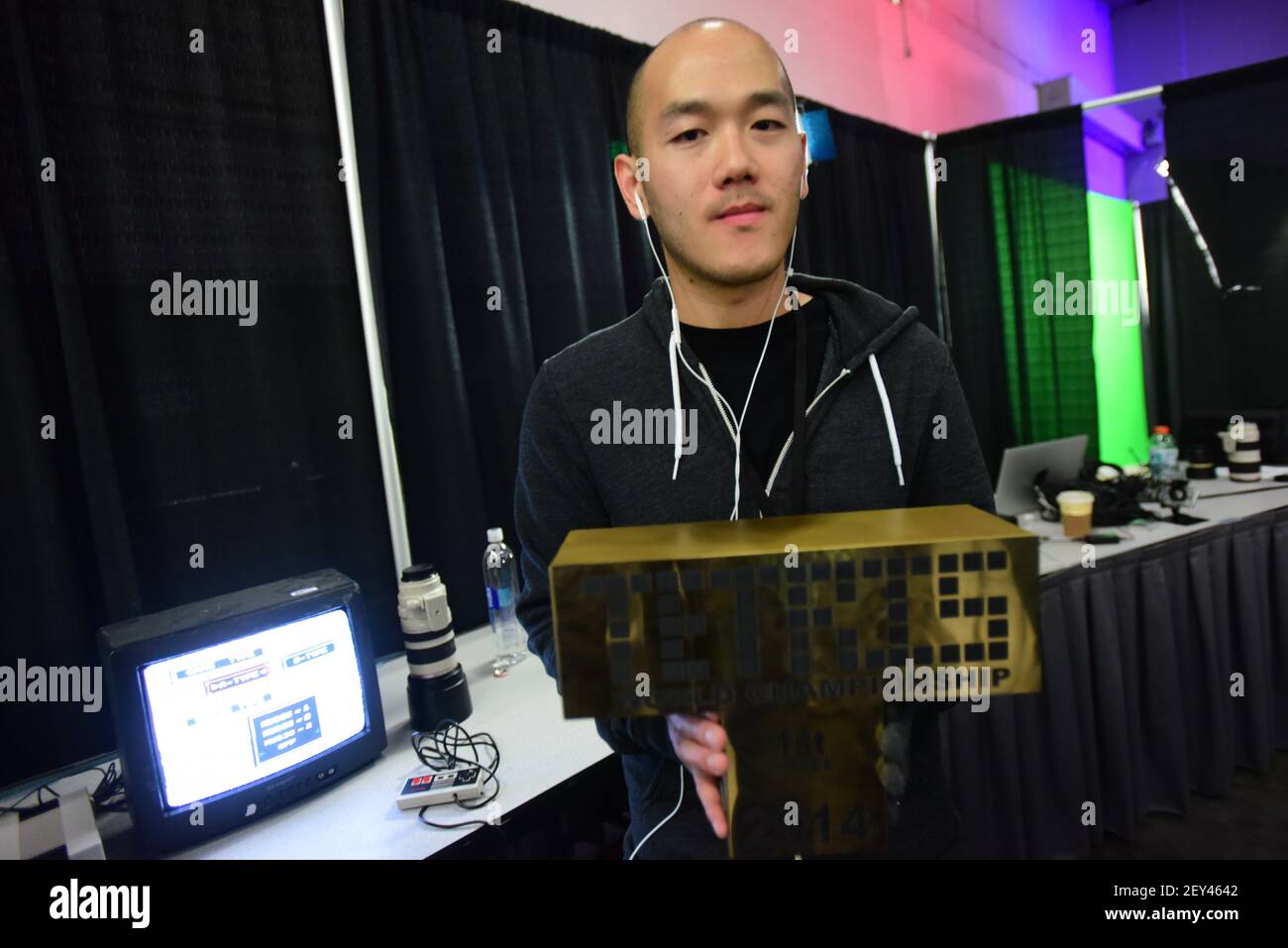 Harry Hong, winner of the Tetris World Championships proudly holds his ...