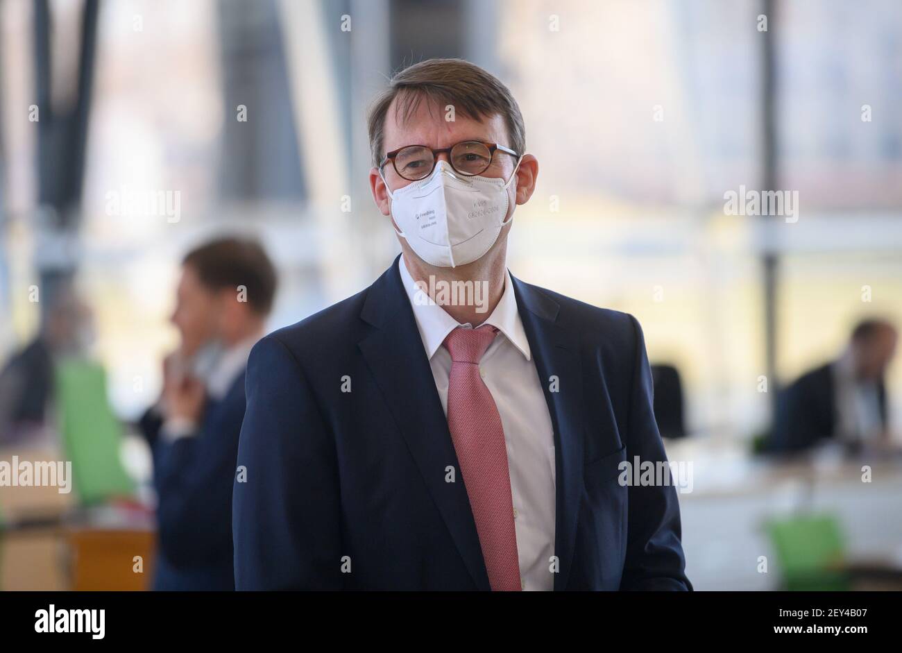 Dresden, Germany. 03rd Mar, 2021. Roland Wöller (CDU), Interior Minister of Saxony, stands at his seat in the plenary hall before the start of a special session of the Saxon state parliament on the Corona lockdown. Credit: Robert Michael/dpa-Zentralbild/ZB/dpa/Alamy Live News Stock Photo