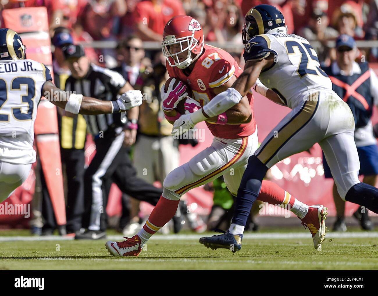 Kansas City Chiefs tight end Travis Kelce (87) gains yardage against the  St. Louis Rams strong safety T.J. McDonald (25) and Rams free safety Rodney  McLeod (23) Sunday, Oct. 26, 2014 at