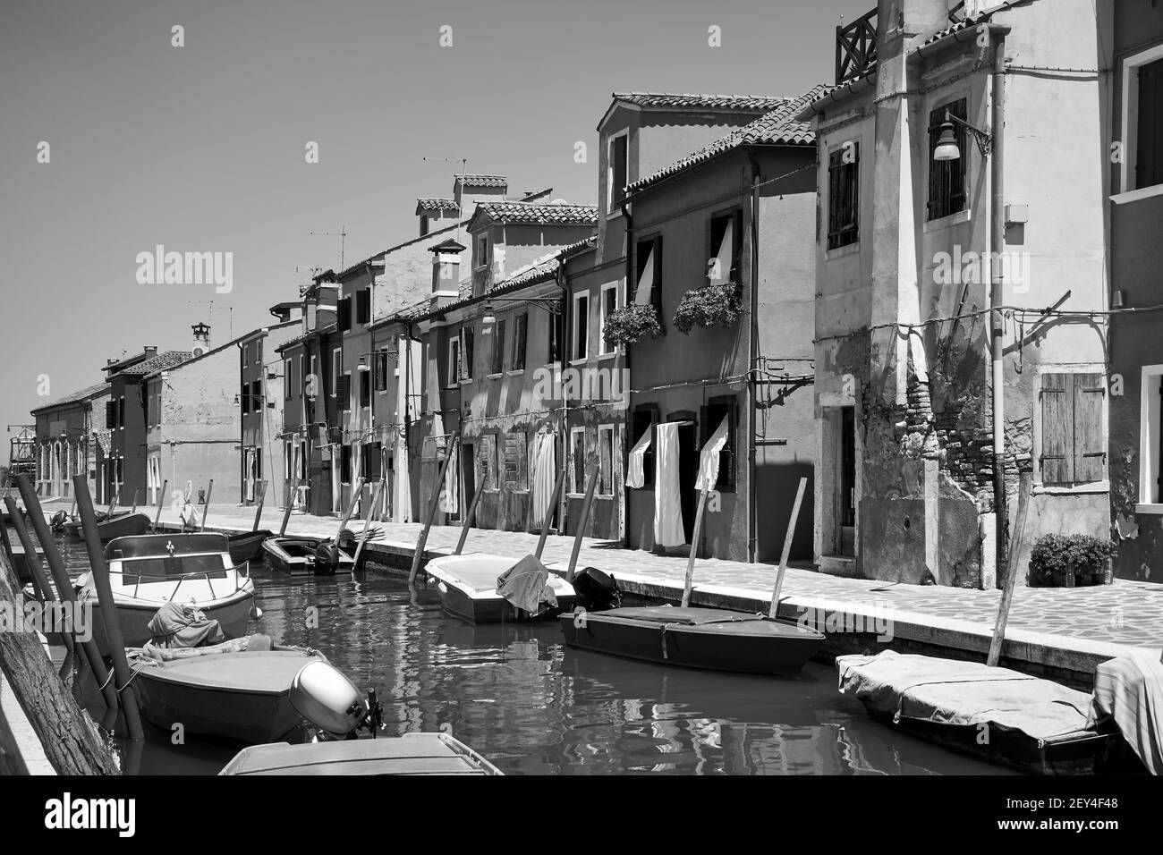 Canal in Burano in Venice, Italy. Black and white photography, italian cityscape Stock Photo