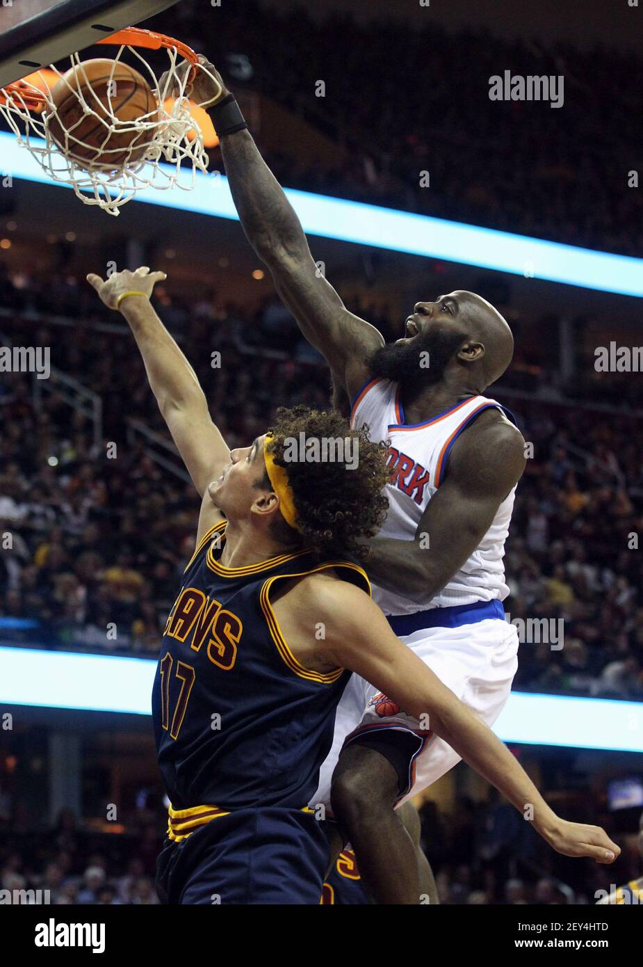 The New York Knicks' Quincy Acy, right, dunks on the Cleveland Cavaliers' Anderson  Varejao during the third quarter on Thursday, Oct. 30, 2014, at Quicken  Loans Arena in Cleveland. The Knicks won,, image size:925x1390