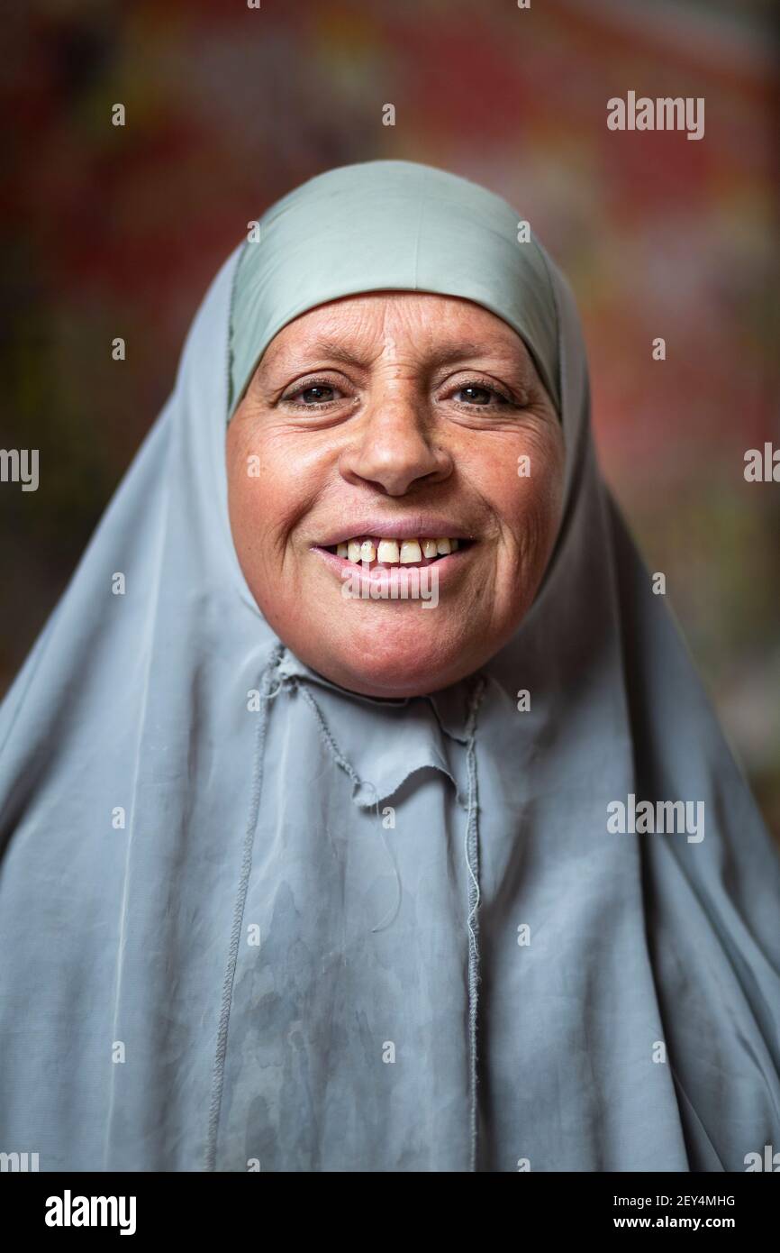 Portrait of a smiling local Egyptian woman wearing a hijab in Downtown Cairo, Egypt Stock Photo