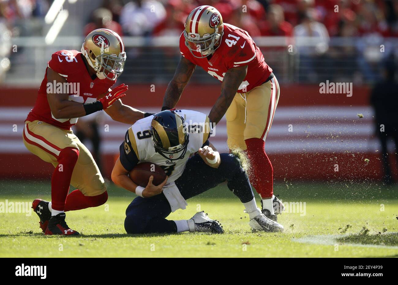 St. Louis Rams quarterback Austin Davis (9) tries to slide but gets a ...