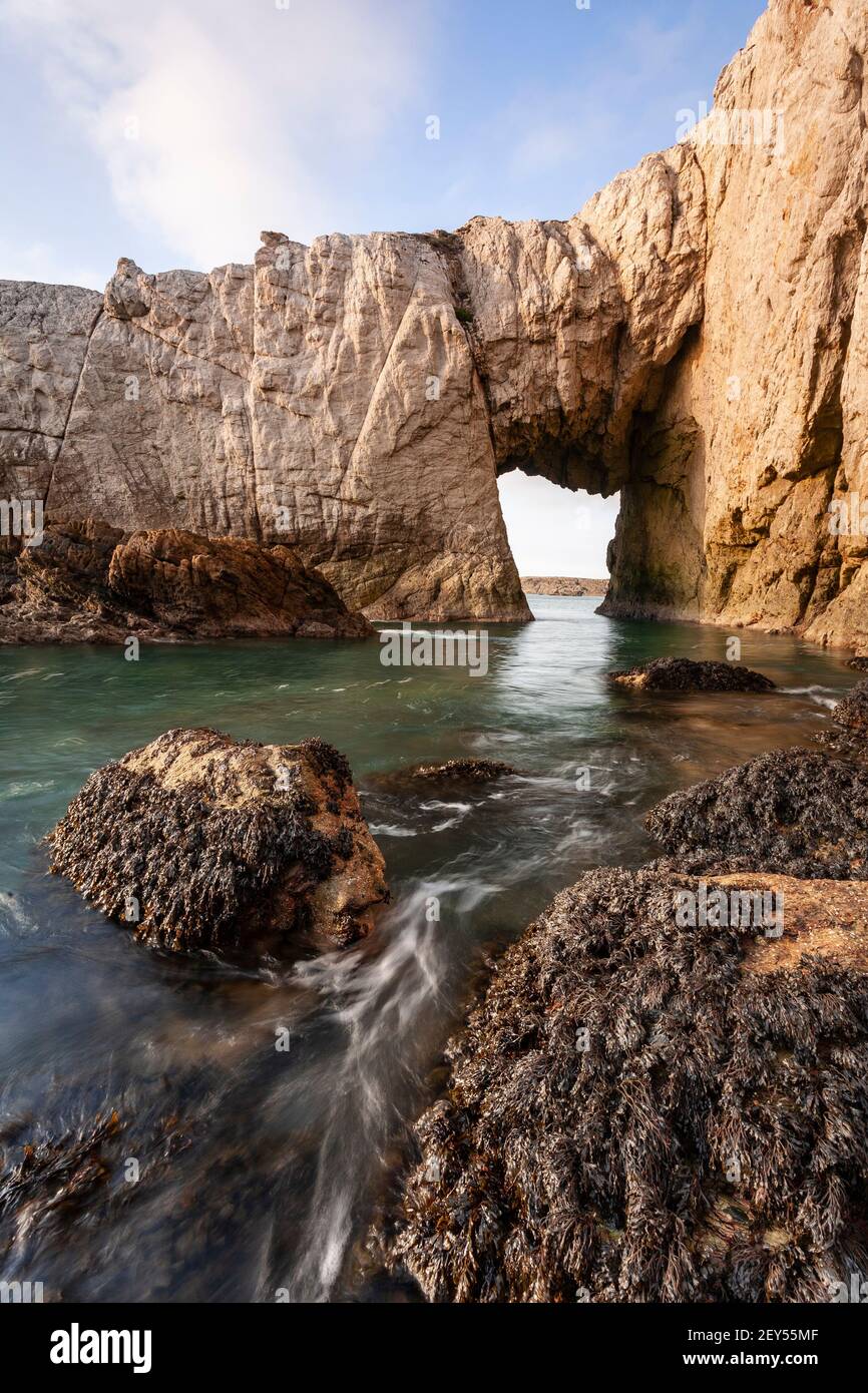Bwa Gwyn sea arch near Rhoscolyn, Anglesey, North Wales Stock Photo