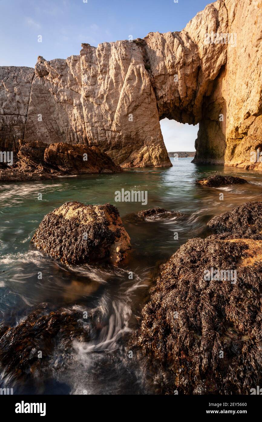 Bwa Gwyn sea arch near Rhoscolyn, Anglesey, North Wales Stock Photo