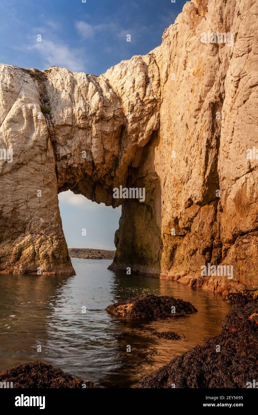 Bwa Gwyn sea arch near Rhoscolyn, Anglesey, North Wales Stock Photo