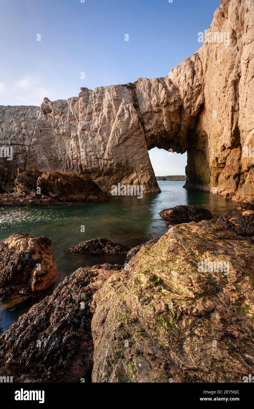 Bwa Gwyn sea arch near Rhoscolyn, Anglesey, North Wales Stock Photo