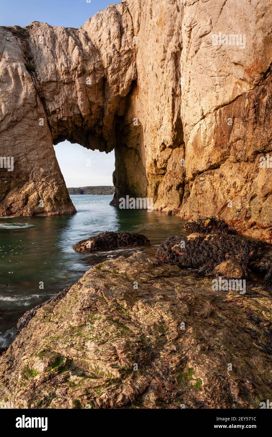 Bwa Gwyn sea arch near Rhoscolyn, Anglesey, North Wales Stock Photo
