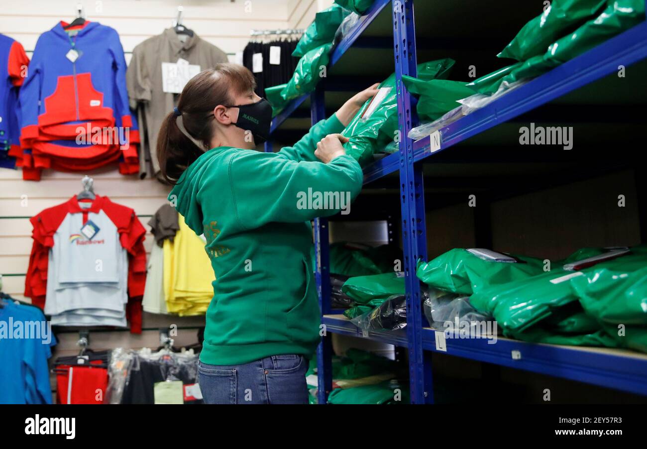 An employee works at 'Maisies Superstore', a school uniform shop, which is  currently only open for online services and order collection due to  coronavirus disease (COVID-19) restrictions, in Wolverton, Milton Keynes,  Britain