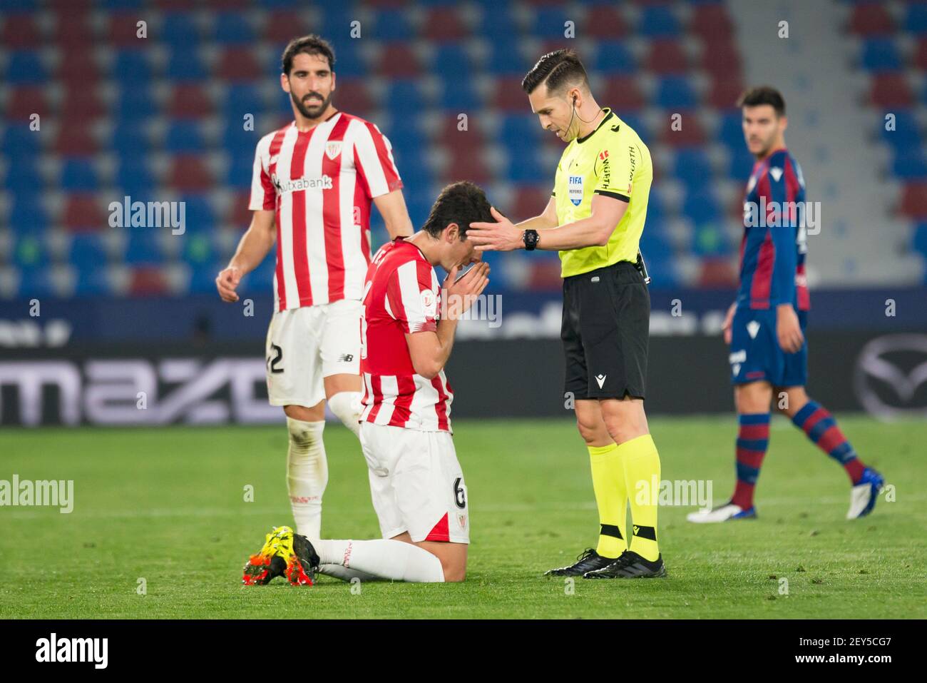 Valencia, Spain. 04th Mar, 2021. Gil Manzano referee and Mikel Vesga, Raul  Garcia of Athletic Bilbao Club in action during the Spanish Copa del Rey  Semi Final Second Leg match between Levante