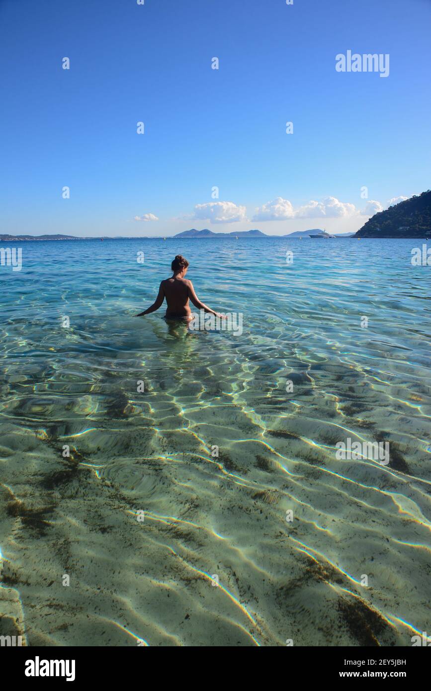 Young woman in a paradisiac beach of Mallorca Stock Photo