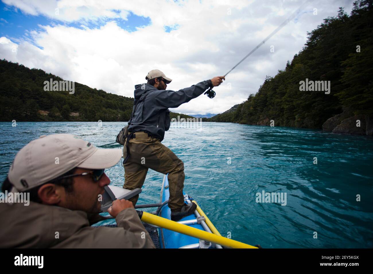 Two fisherman float down the Rio Baker in southern Chile in a region called Patagonia. Stock Photo
