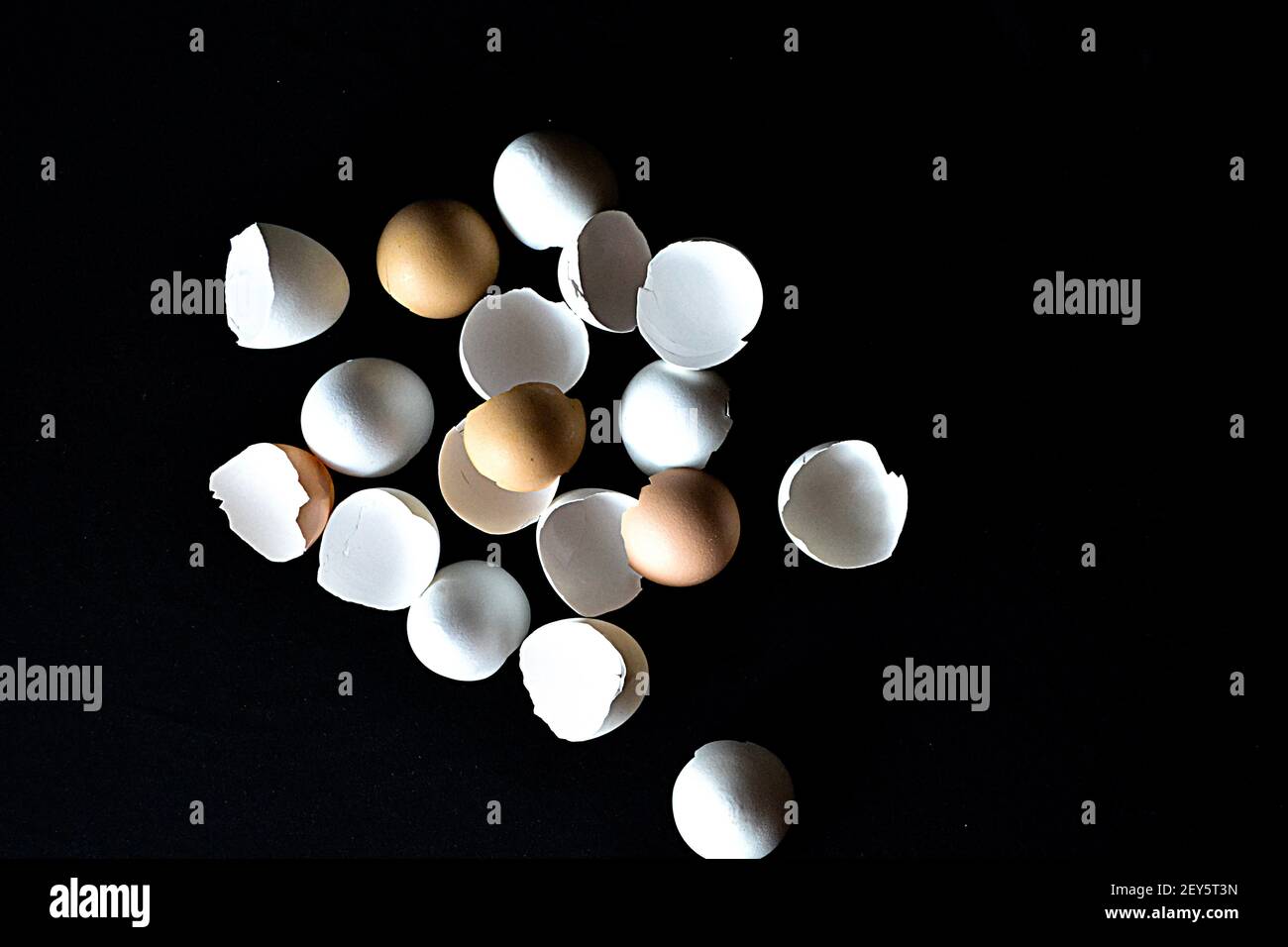 broken eggshells on black background Stock Photo