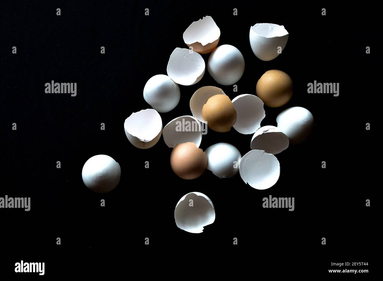 broken eggshells on black background Stock Photo