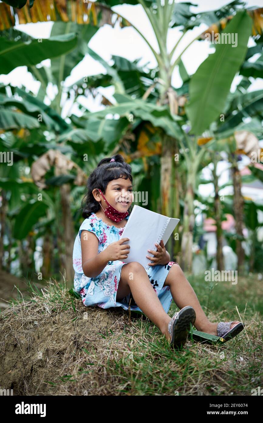 Indian school girls reading book hi-res stock photography and images ...