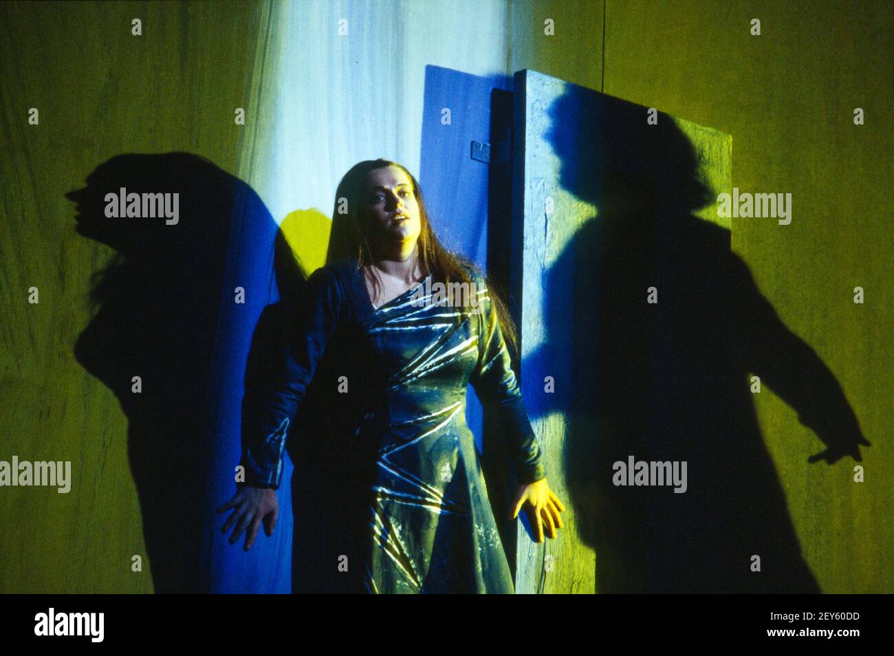 Ulla Gustafsson (Sieglinde) with the shadow of Siegmund in DIE WALKURE by Wagner at The Royal Opera, Covent Garden, London WC2 14/10/1994 conductor: Bernard Haitink design: Nigel Lowery lighting: Pat Collins movement: Matthew Hamilton director: Richard Jones Stock Photo