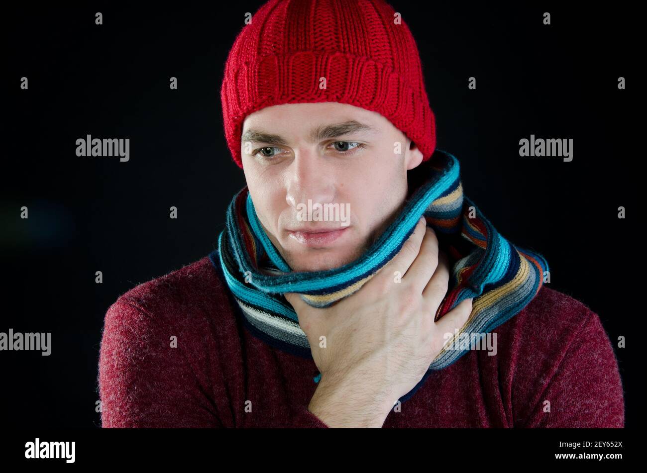 Young attractive guy is drinking a hot drink. Stock Photo