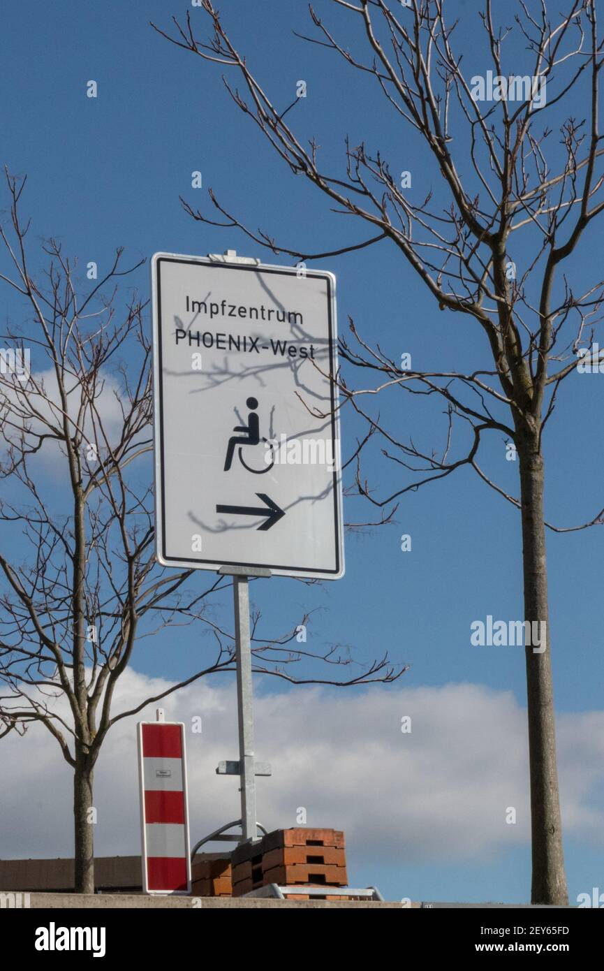 Dortmund, NRW, Germany, 05th Mar 2021. Signage and directions for wheelchair users to Impfzentrum Phoenix-West. Phoenix West, a former blast furnace and industrial site now housing culture and music venues is currently Dortmund's largest and busiest vaccination centre. The vaccination campaign in Germany is picking up momentum. Earlier this week, The German health ministry and vaccination commission STIKO cleared Astra Zeneca's vaccine for use in the over 65 age group. In addition, GP practices can start administering vaccinations soon. Accordingly, several federal states have started vaccina Stock Photo
