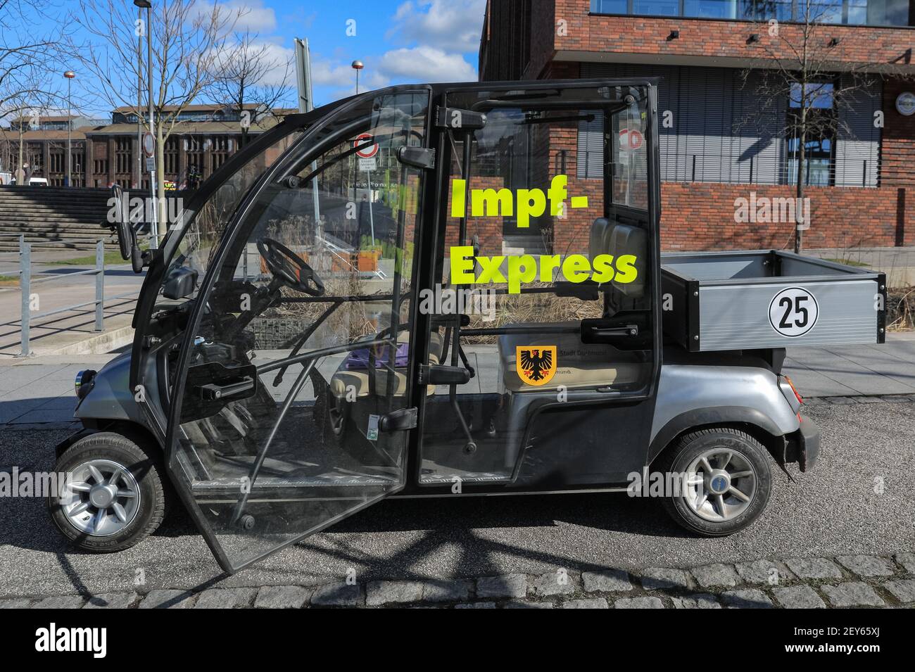 Dortmund, NRW, Germany, 05th Mar 2021. 'Impf-Express' a fleet of small electric cars is on stand-by for elderly and immobile people to be taken to the entrance. Phoenix West, a former blast furnace and industrial site now housing culture and music venues is currently Dortmund's largest and busiest vaccination centre. The vaccination campaign in Germany is picking up momentum. Earlier this week, The German health ministry and vaccination commission STIKO cleared Astra Zeneca's vaccine for use in the over 65 age group. In addition, GP practices can start administering vaccinations soon. Accordi Stock Photo