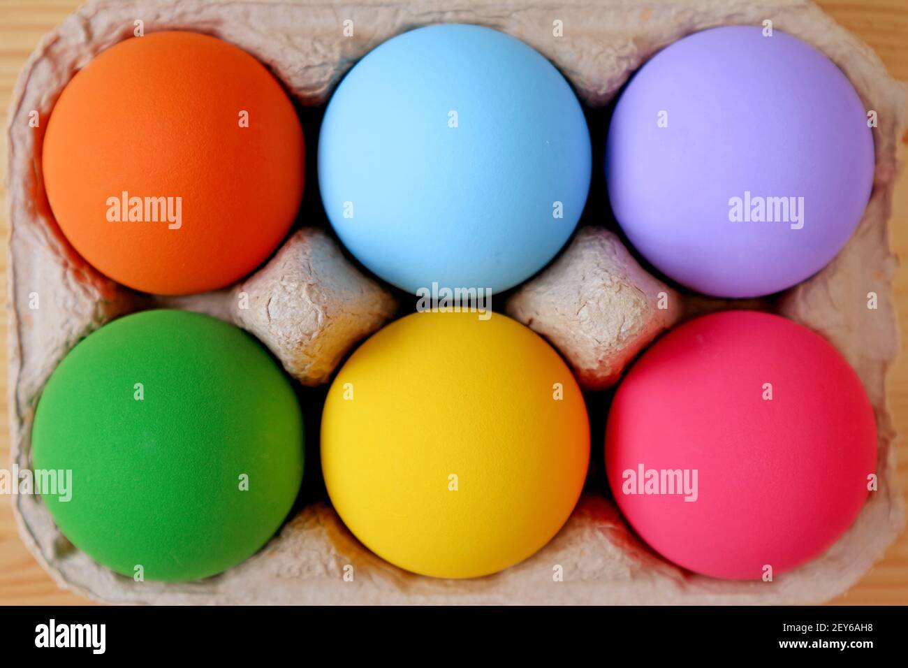 Top View of Multi-colored Easter Eggs in a Carton Stock Photo