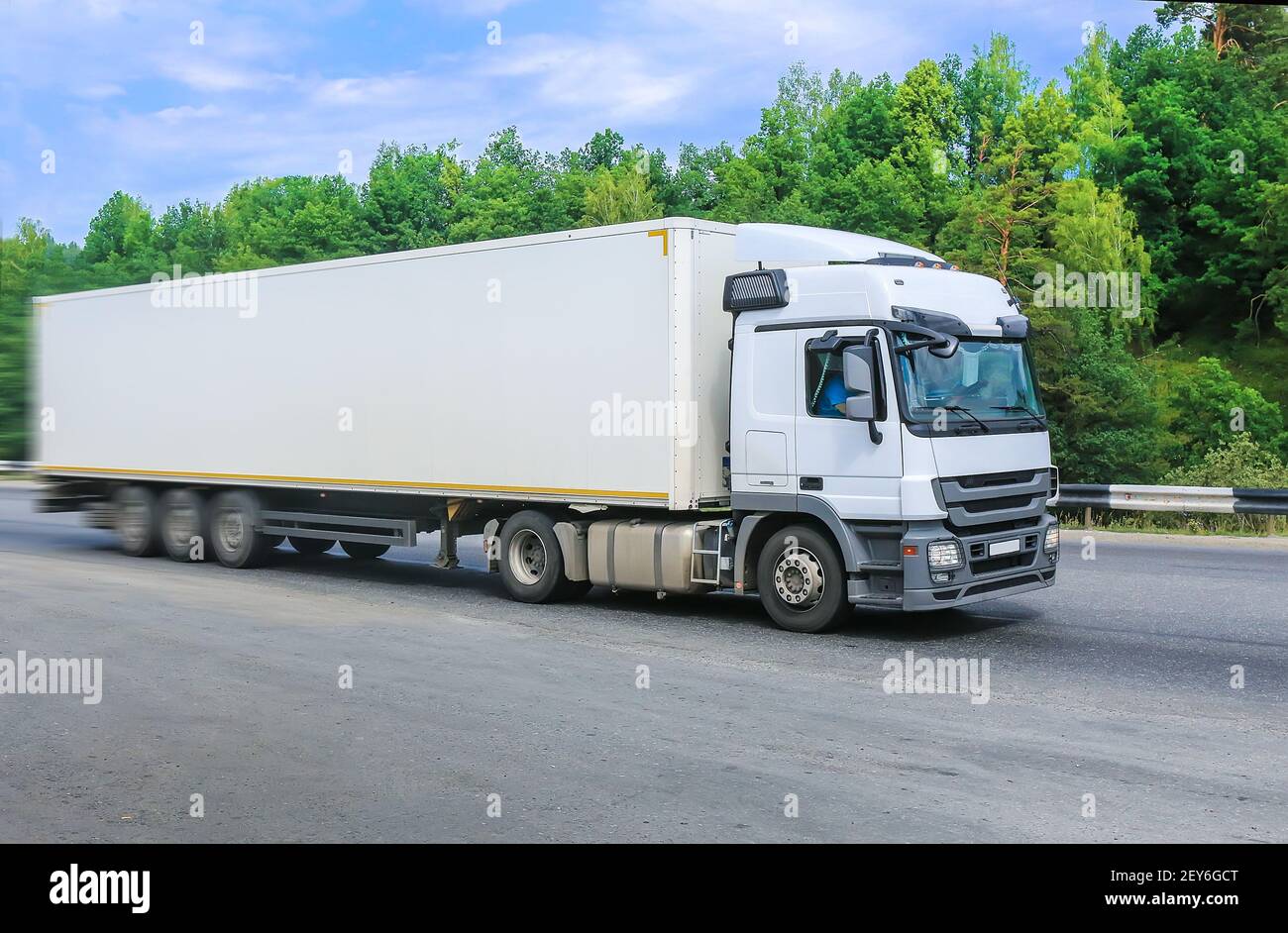 big white truck goes on the highway Stock Photo Alamy
