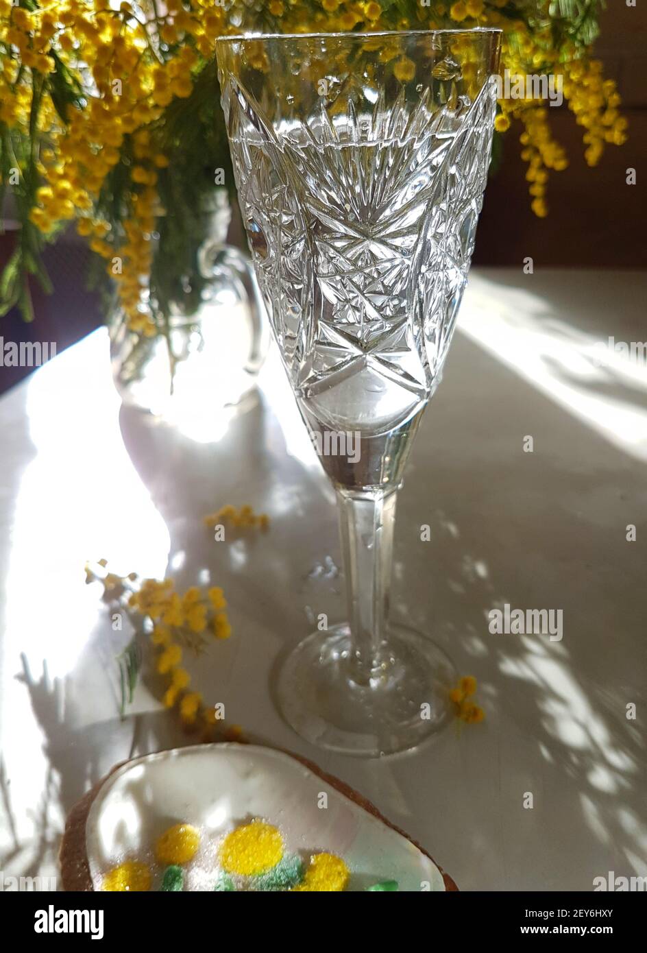 Mimosa bouquet with wine background Stock Photo - Alamy