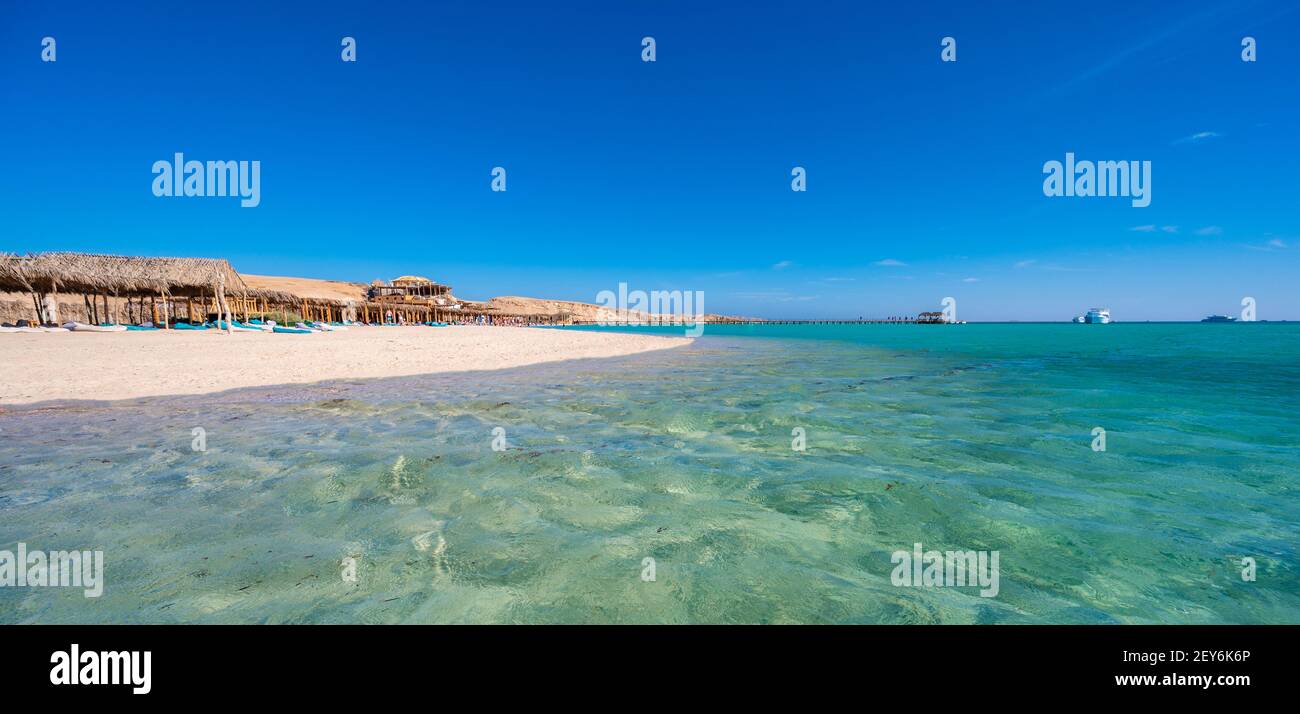 Orange Bay with white beach and crystal clear azure water - paradise coastline of Giftun island, Mahmya, Hurghada, Red Sea, Egypt Stock Photo