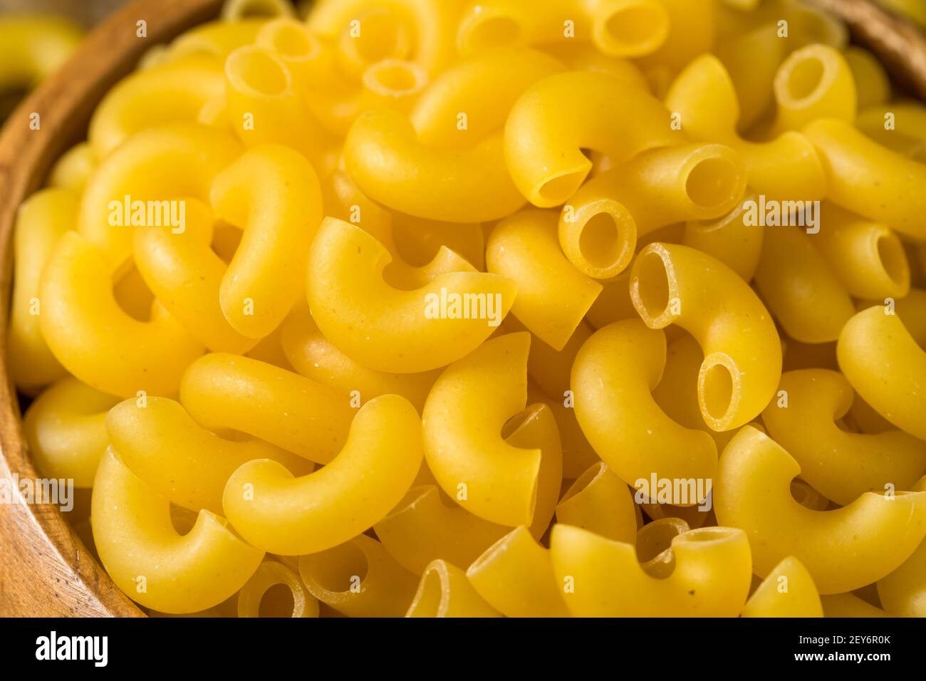 Dry Organic Macaroni Elbow Pasta in a Bowl Stock Photo