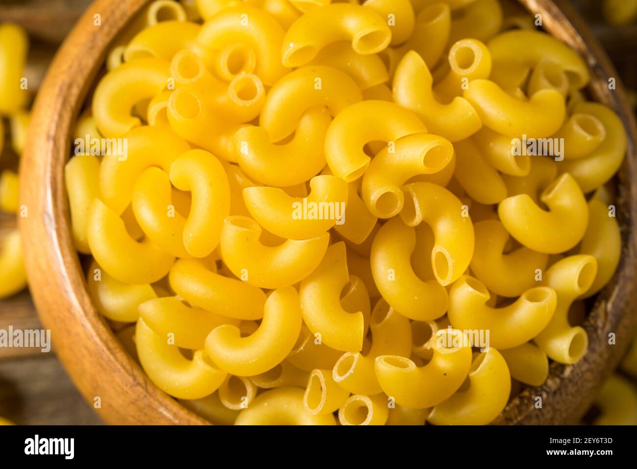 Dry Organic Macaroni Elbow Pasta in a Bowl Stock Photo